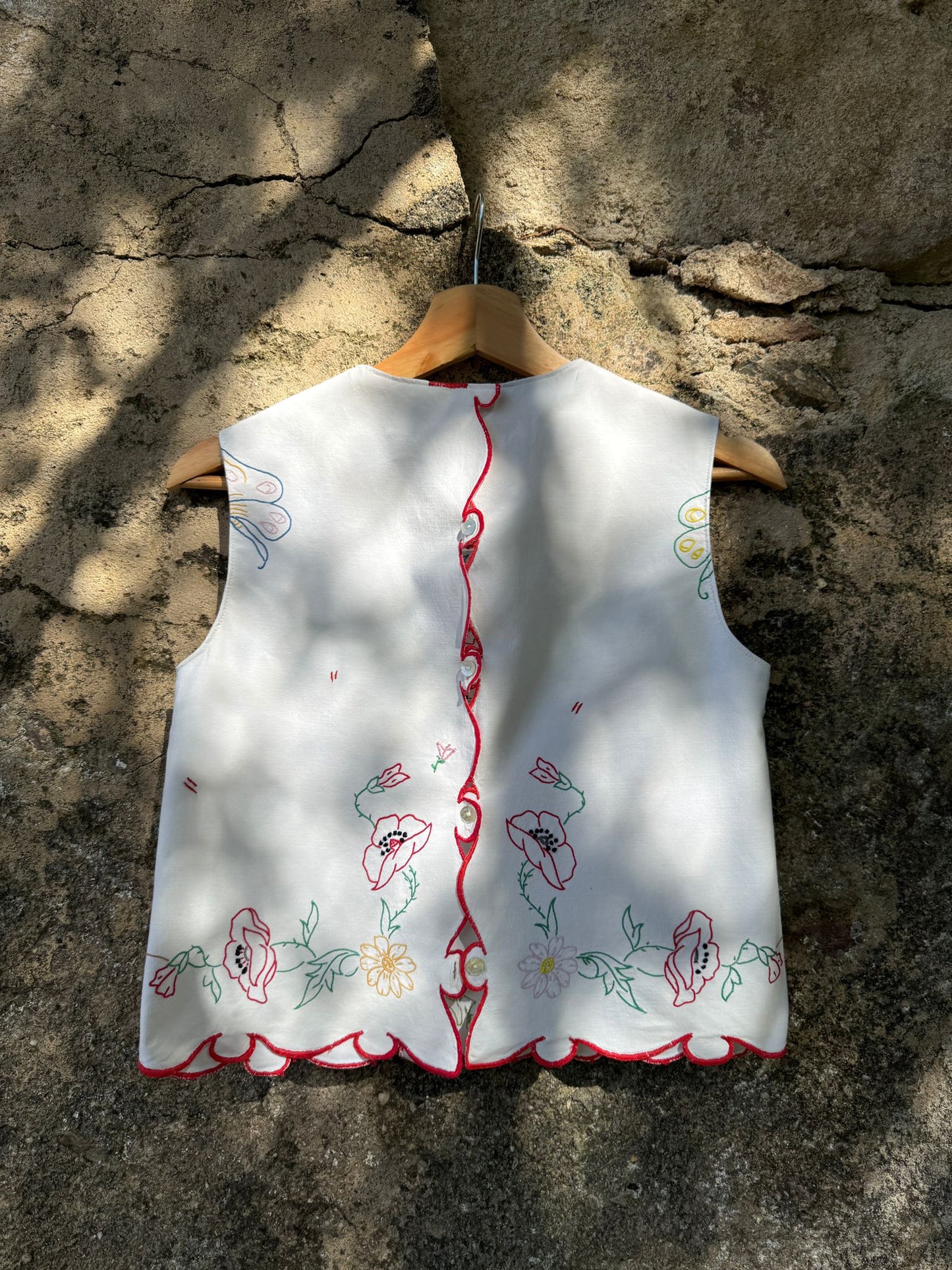 Carrego comigo flores de muitas cores